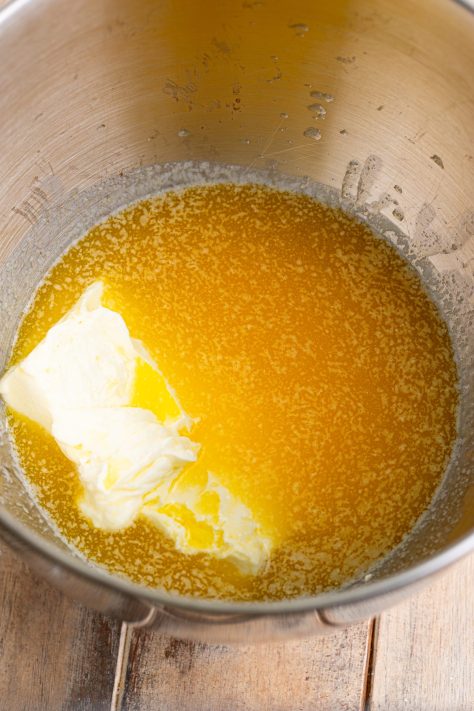 A bowl with oil, butter, and cream cheese.