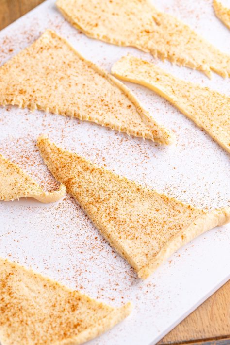 Crescent rolls with cinnamon rolled out.