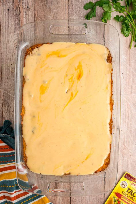 Queso on top of Beef Taco Rice Casserole.