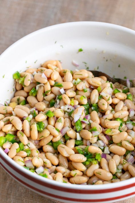 Beans, onions, and peppers in a dill sauce.