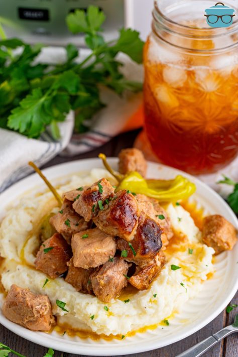 A pile of Mississippi Pork Bites on a pile of mashed potatoes.