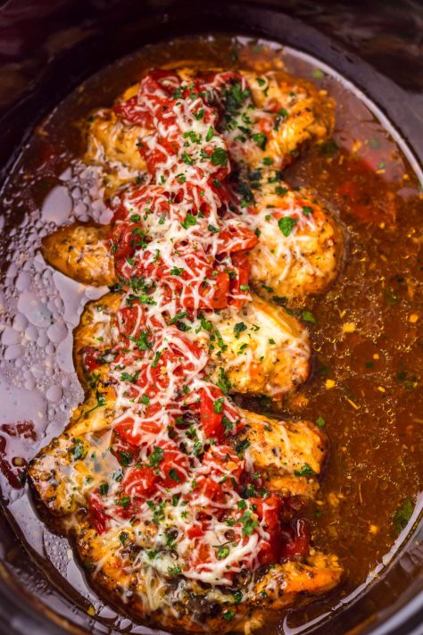 Crock Pot Bruschetta chicken fully cooked in the slow cooker.