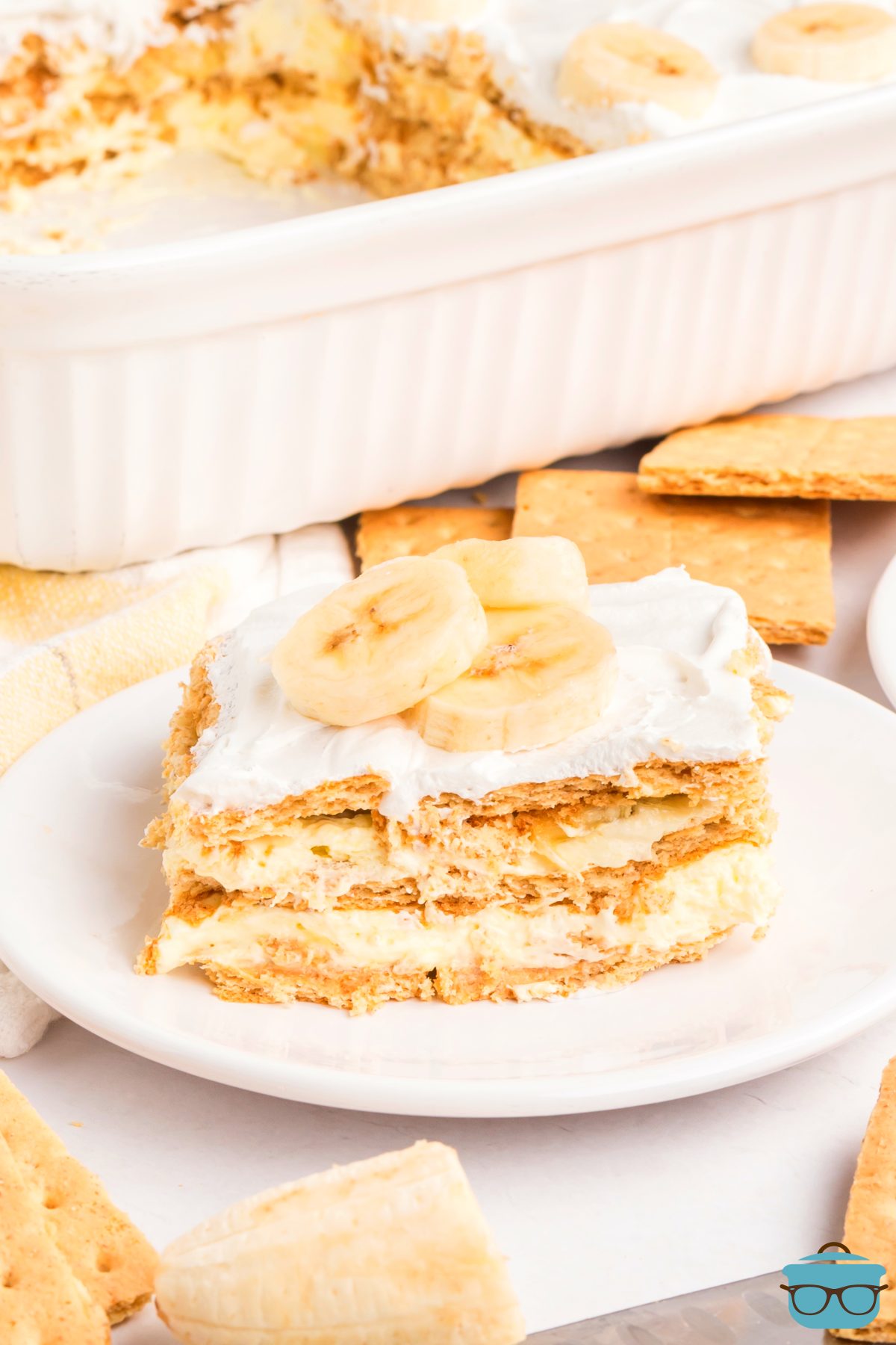 A plate with a slice of Banana Pudding Eclair Cake. 