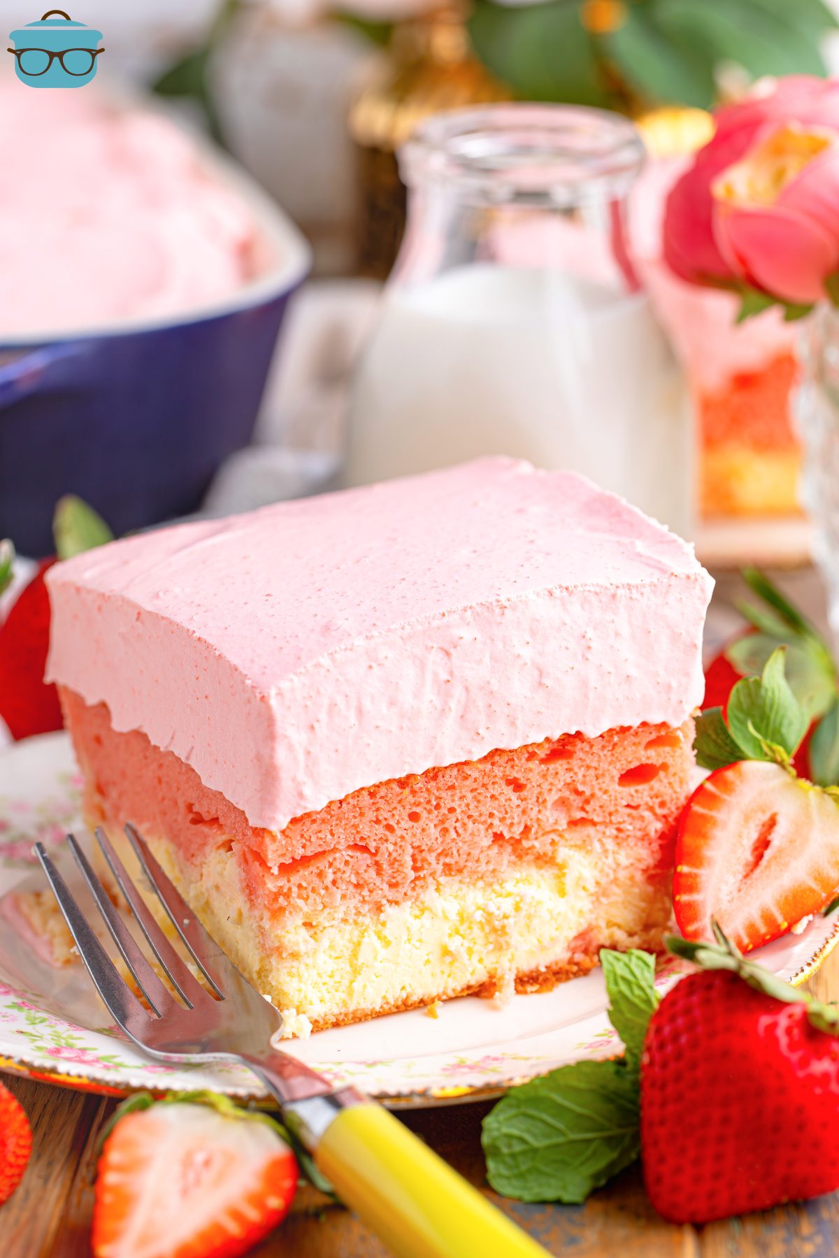 A small dessert plate with a slice of Strawberry Love Cake.