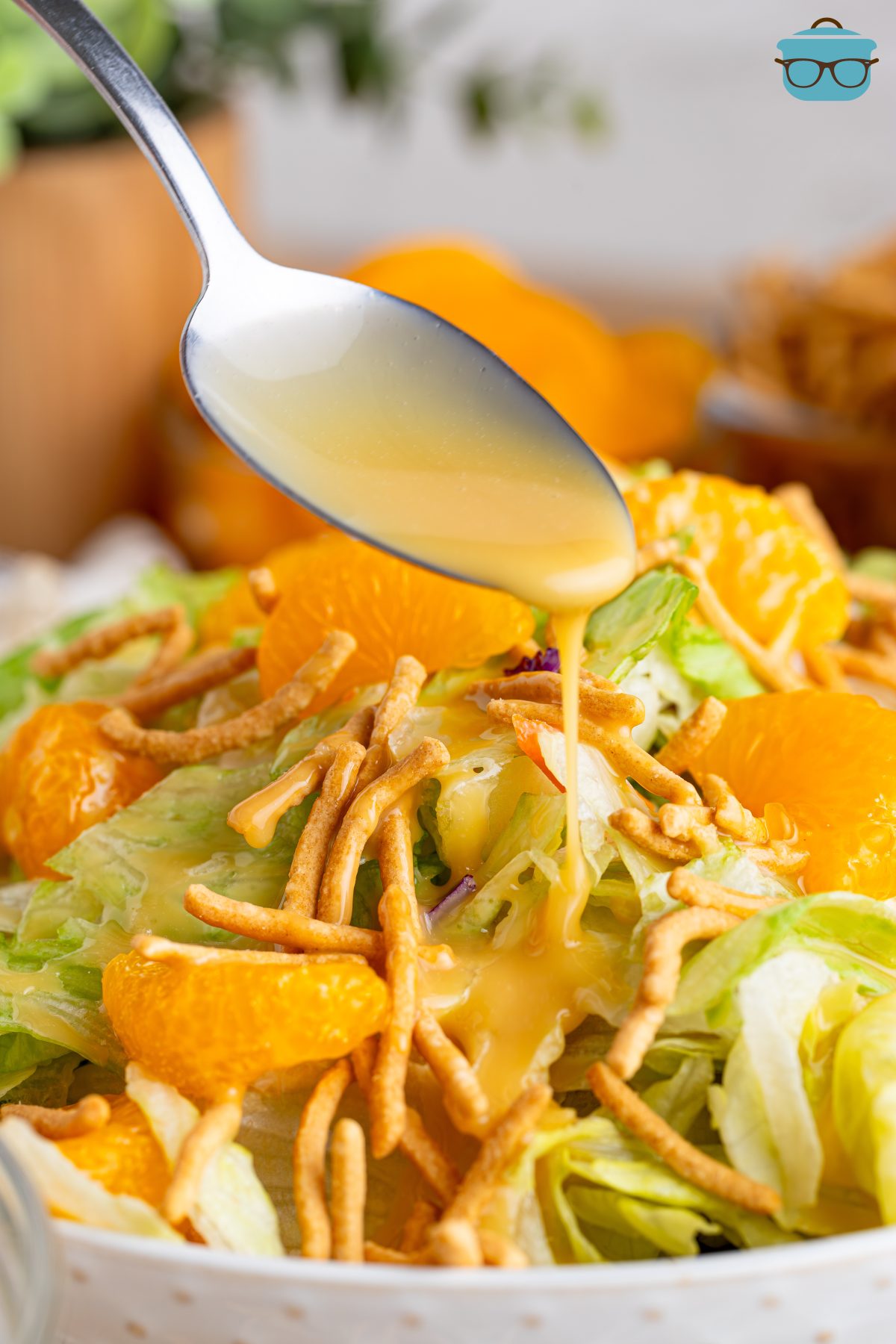 Some Homemade Teriyaki Salad Dressing drizzled over a salad.