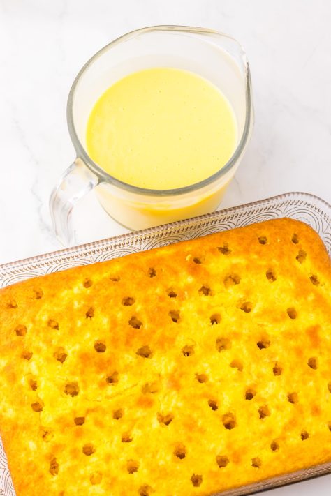 A baked cake with holes in the cake.