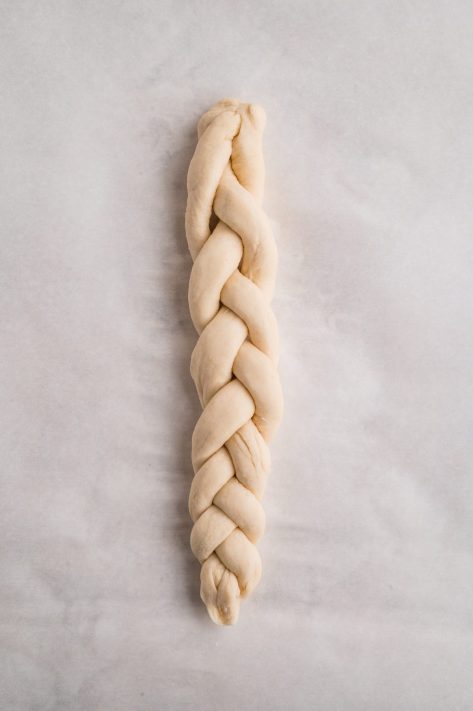 A braided strand of bread dough.