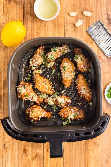 Garlic Parmesan Wings in an Air Fryer basket.
