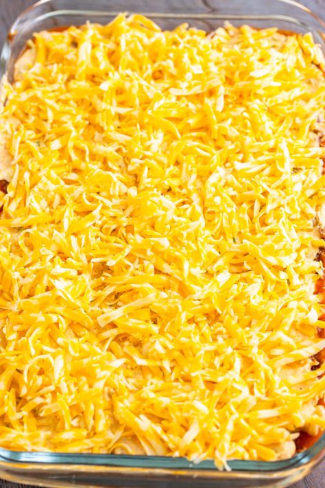 Shredded cheese over the layered Texas Trash.
