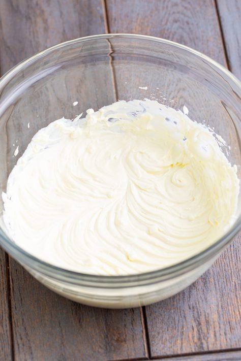 A bowl of whipped cream cheese.