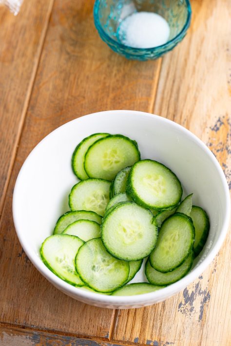 A bowl of cucumbers and salt.