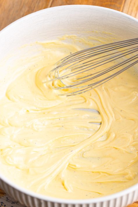 A Japanese dressing being whisked together in a bowl.