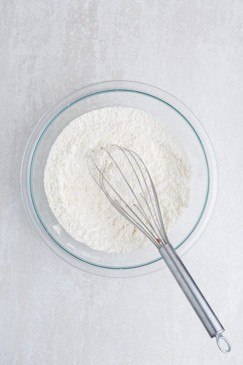 A whisk mixing cobbler topping.