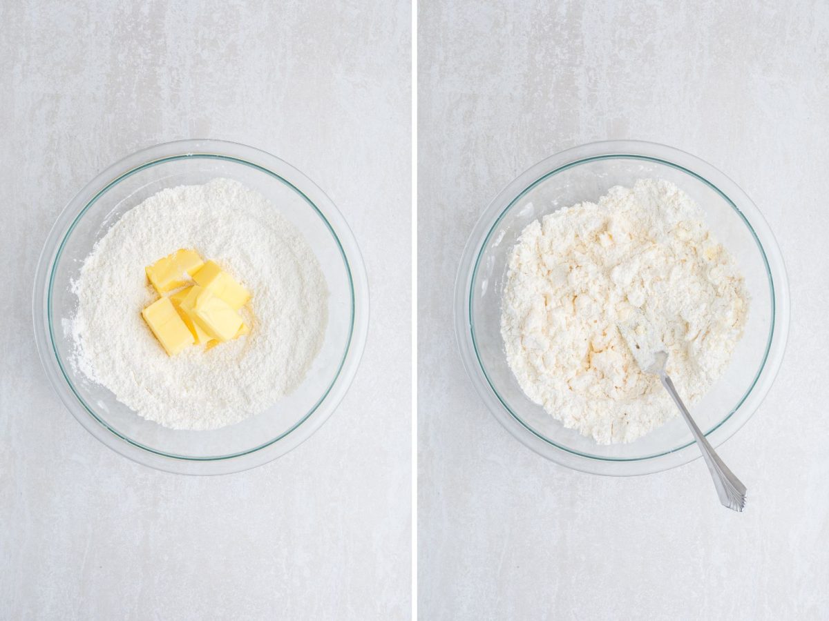 Cubed butter being mixed into flour mixture in a bowl.