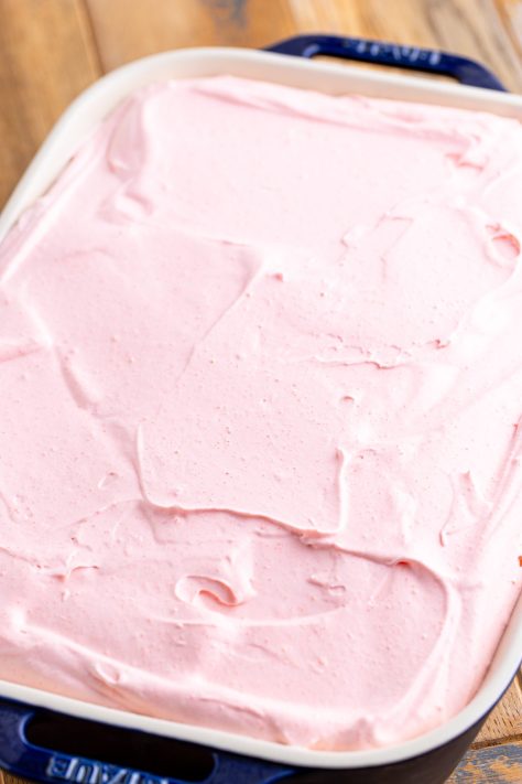 A layered Strawberry Love Cake in a baking dish.