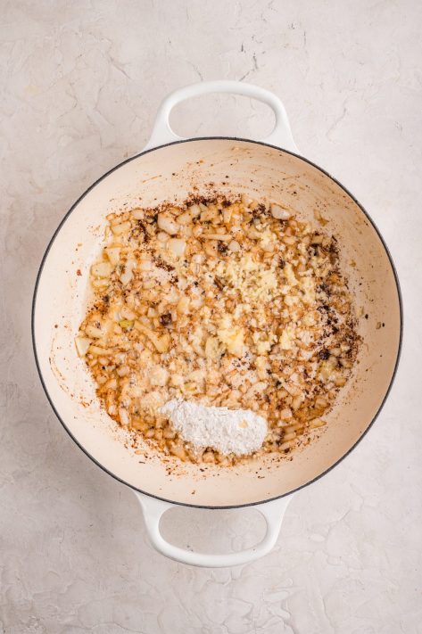 Garlic, onions, and flour cooking in a pan.