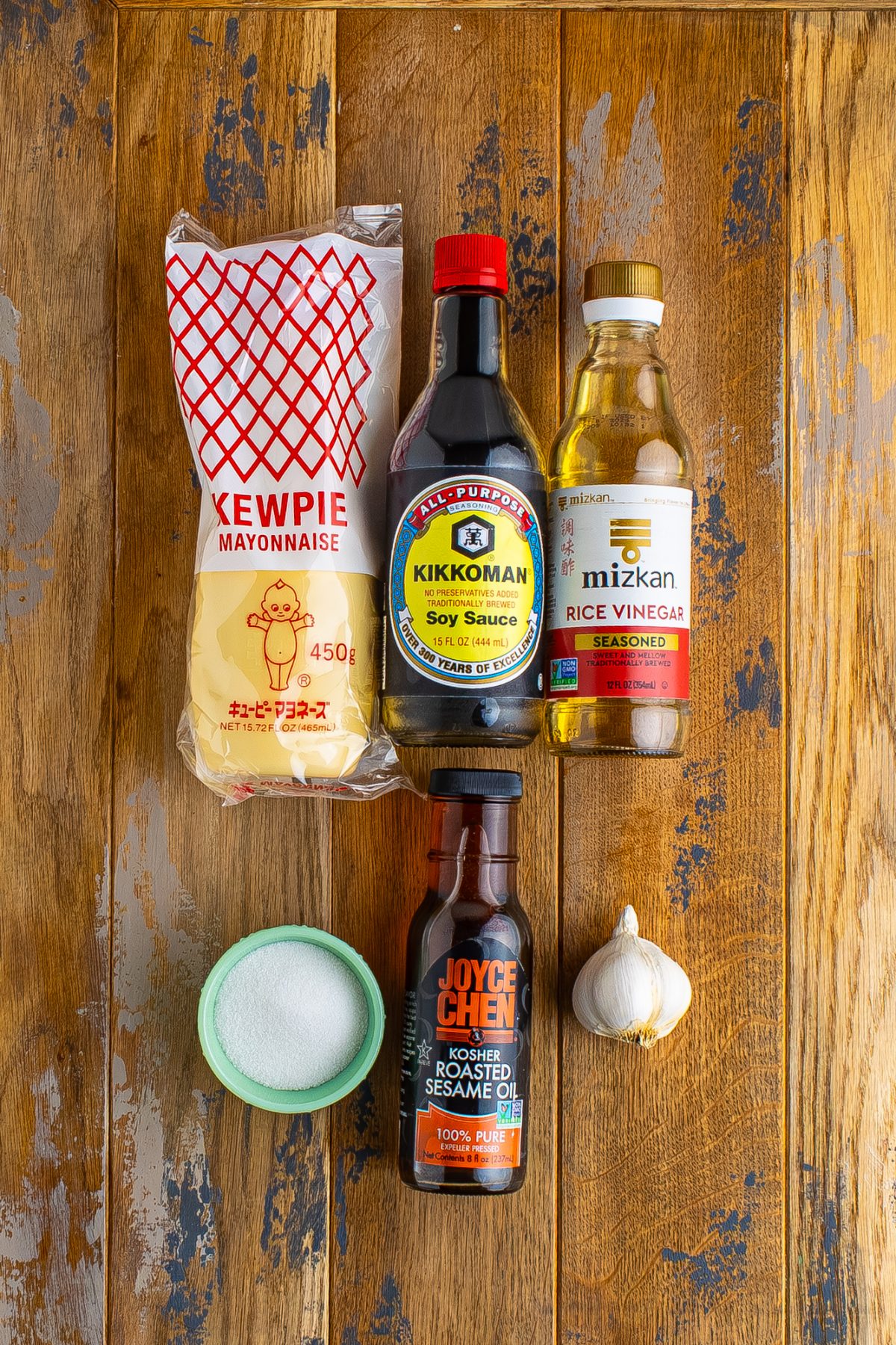 Kewpie mayonnaise, garlic, granulated sugar, seasoned rice vinegar, soy sauce, and sesame oil.