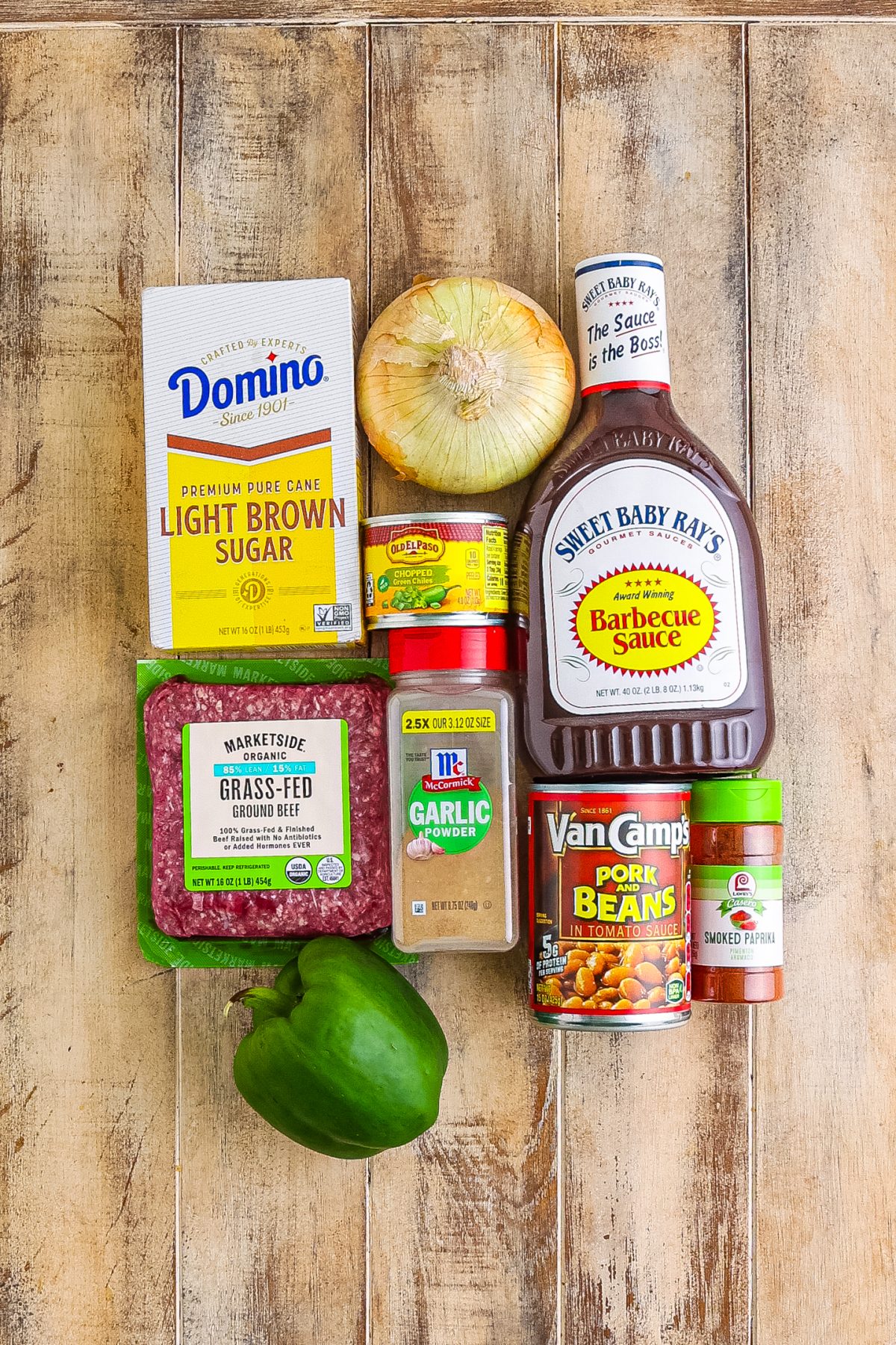 Ground beef, sweet onion, green bell pepper, garlic powder, smoked paprika, pork and beans, diced green chiles, barbecue sauce, and brown sugar.