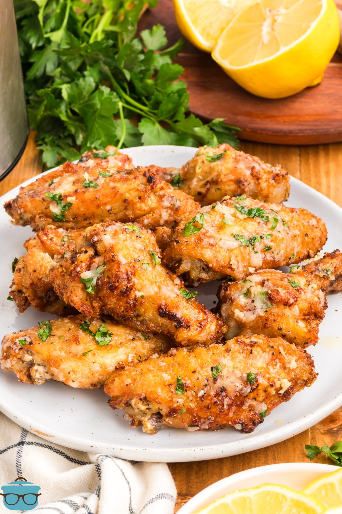A bunch of Garlic Parmesan Chicken Wings on a plate.