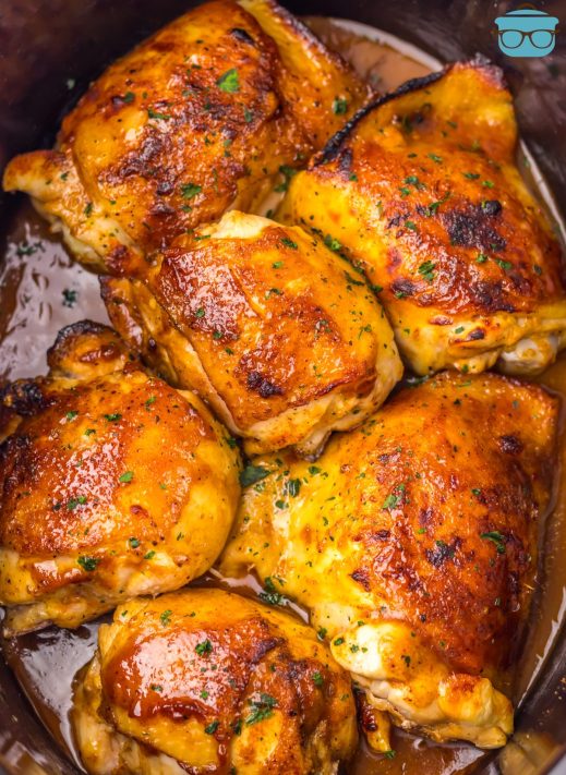 A bunch of Dr Pepper Chicken Thighs in a Slow Cooker.