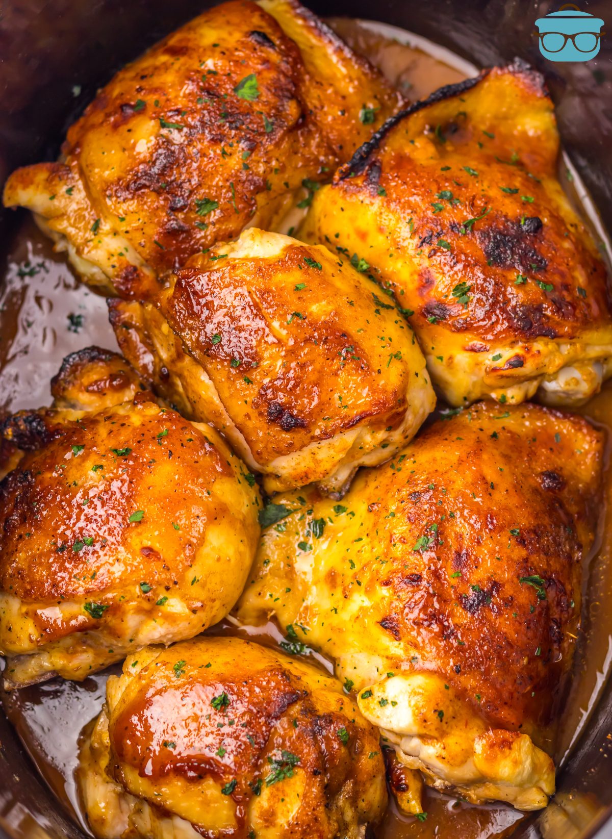 A bunch of Dr Pepper Chicken Thighs in a Slow Cooker.