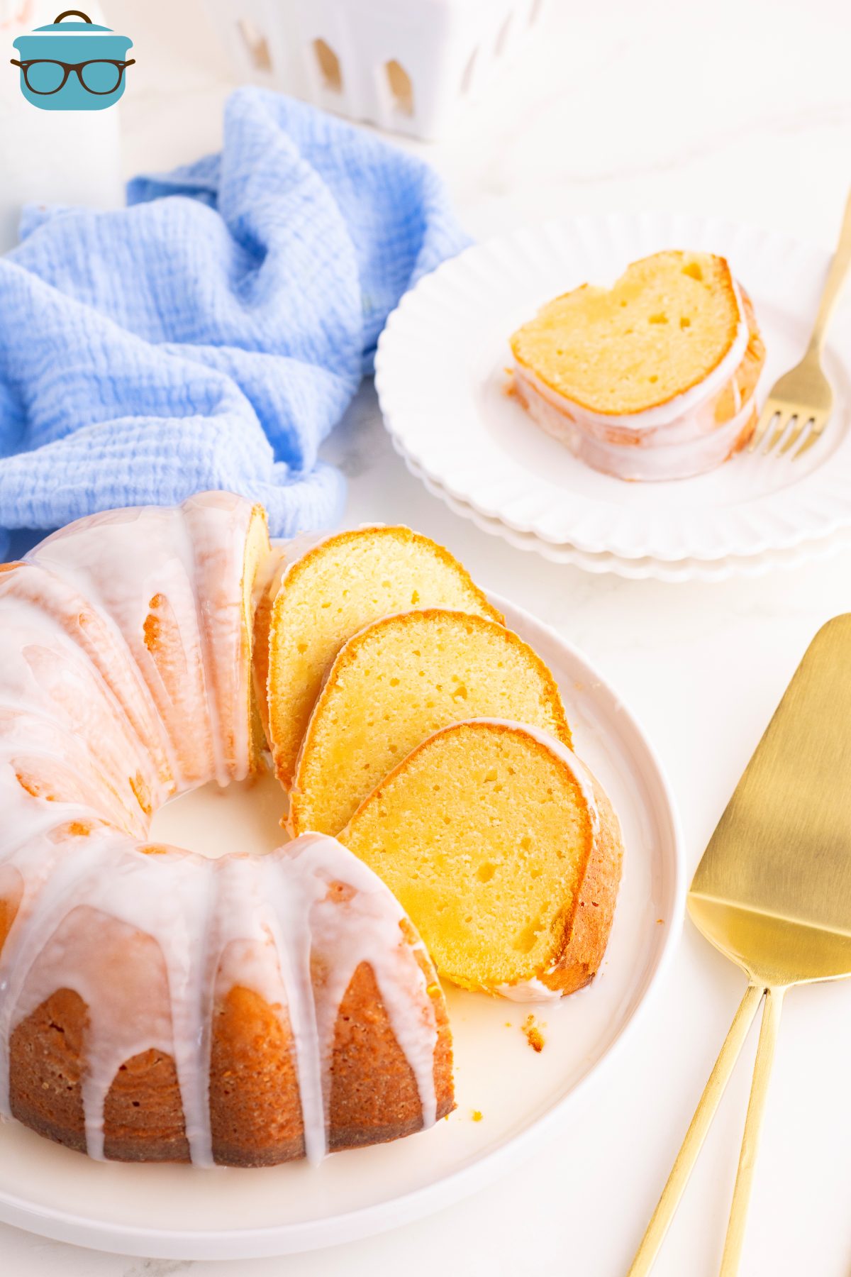 A beautiful, made from scratch Lemon Pound Cake with a sweet glaze with a few slices already cut.