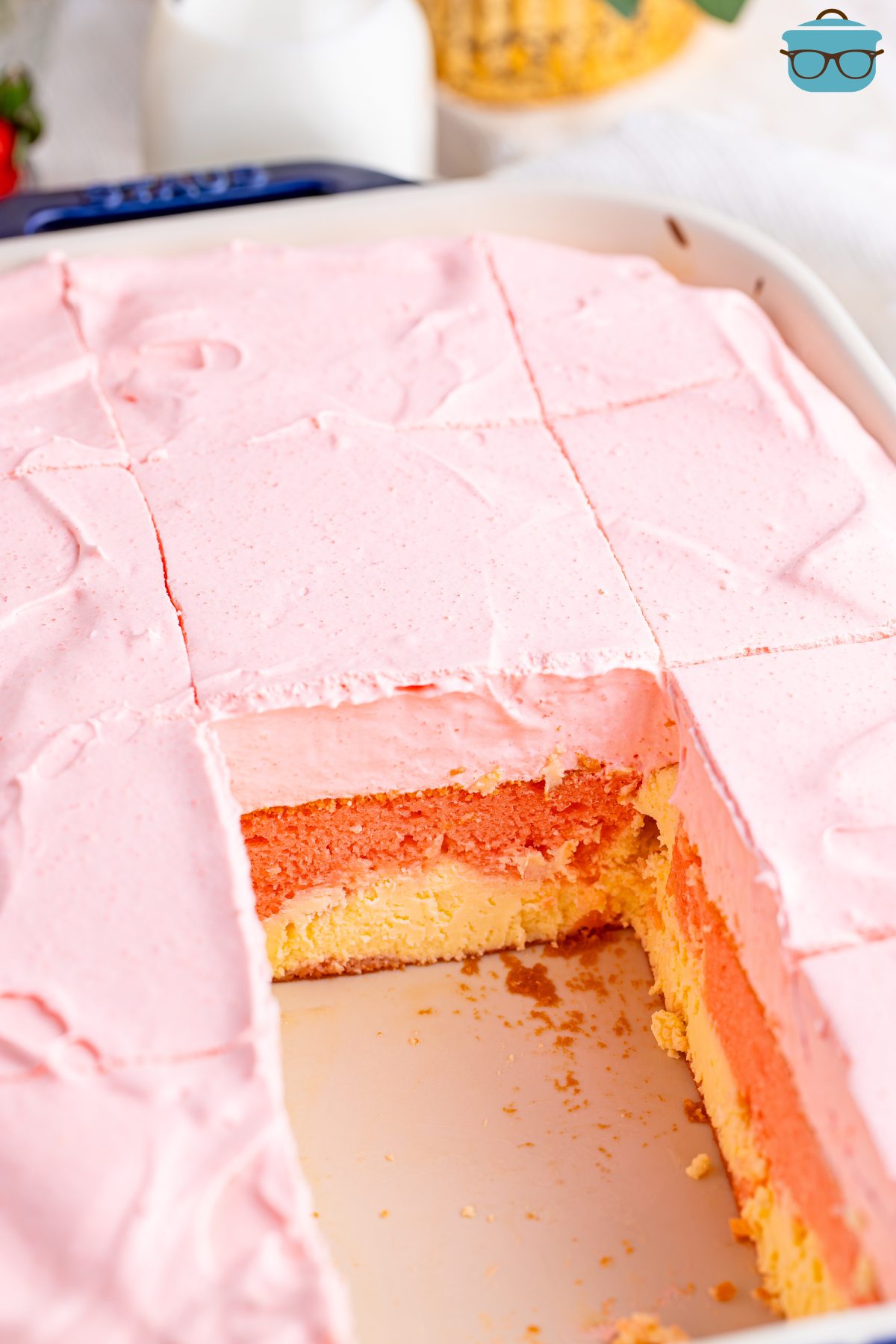 A Strawberry Love Cake with a piece missing.