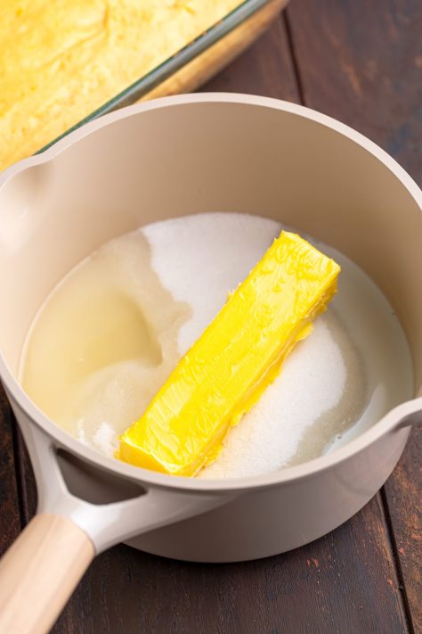 A pan with sugar, butter, milk, lemon juice, and salt.
