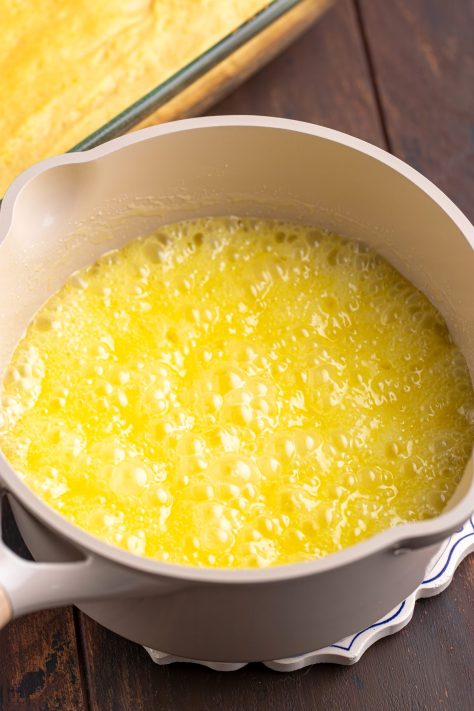 A butter mixture boiling in a pan.