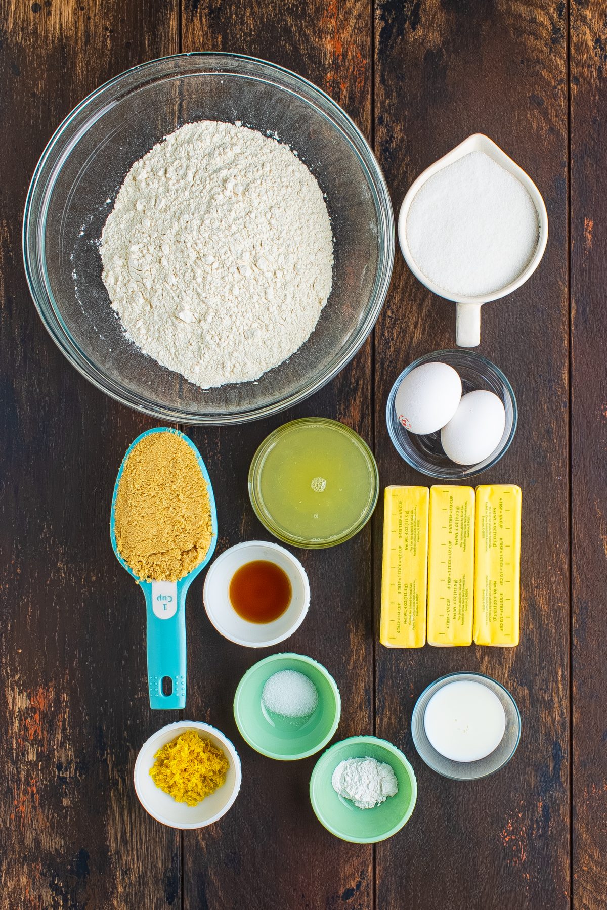 All-purpose flour, baking powder, salt, light brown sugar, unsalted butter, eggs, lemon zest, fresh lemon juice, vanilla extract, granulated sugar, and milk.