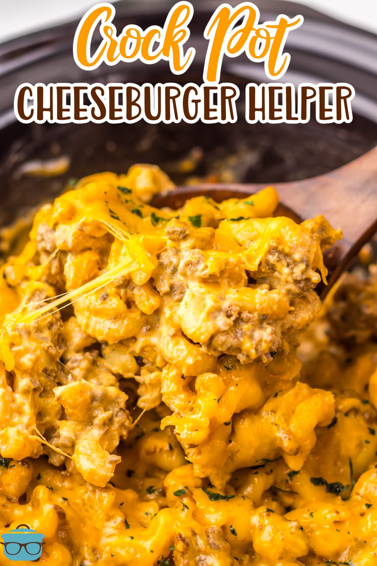 A scoop of Crock Pot Cheeseburger Helper being moved around in the Slow Cooker.