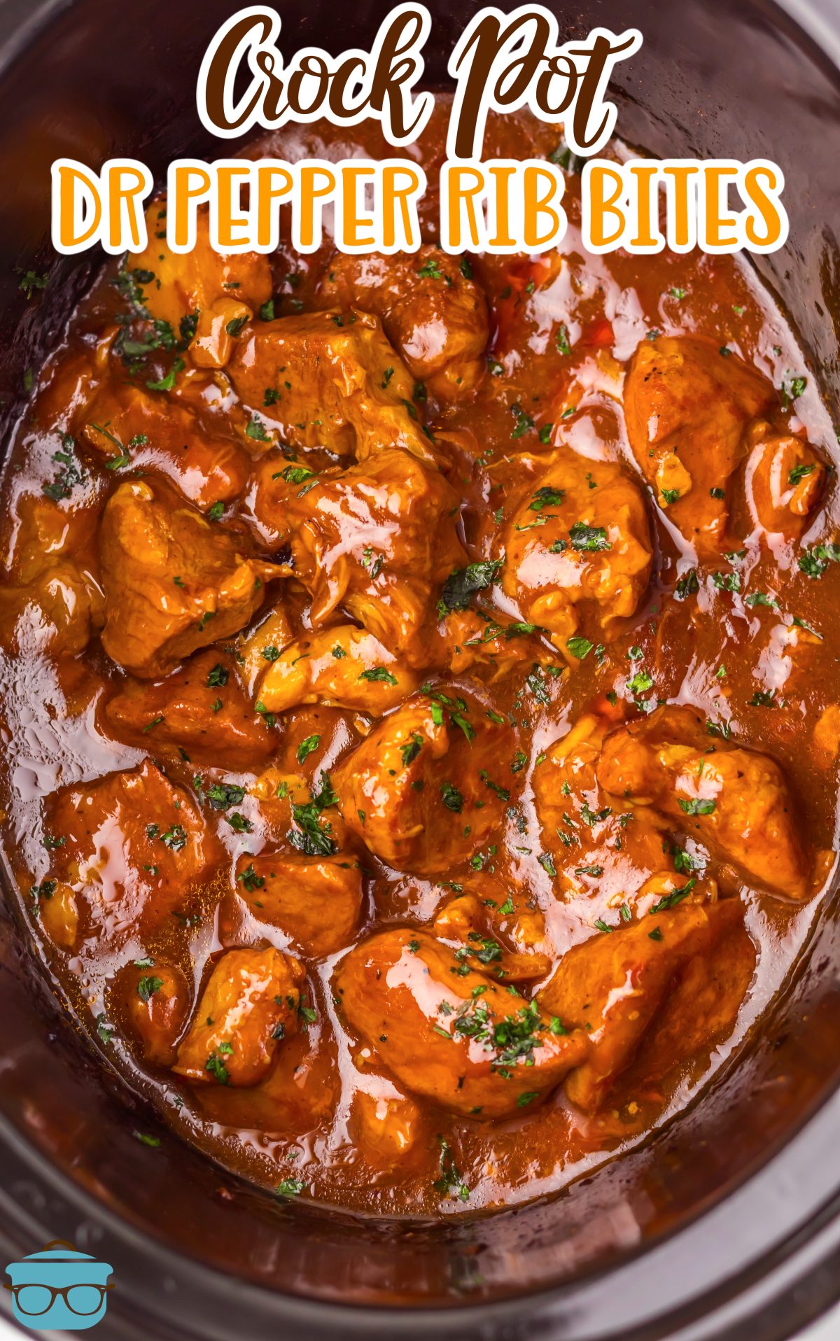 Looking down on a Crock pot Dr Pepper Rib Bites with lots of sauce.