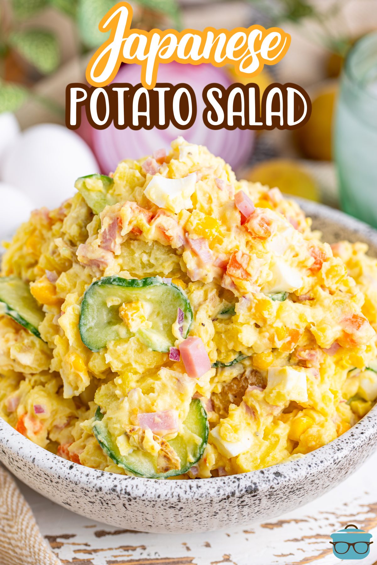 A big white serving bowl of Japanese Potato Salad.