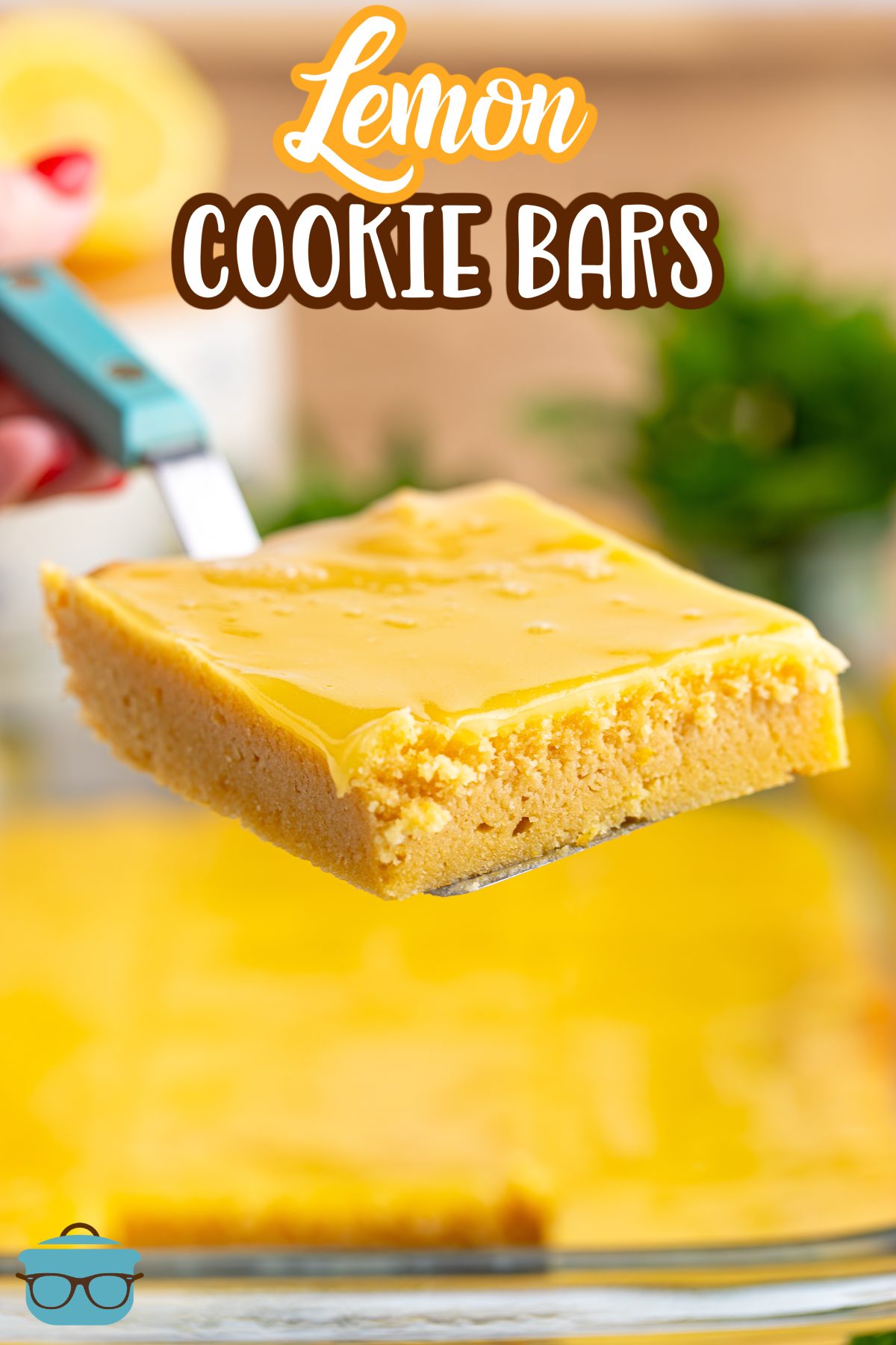 A spatula holding a Lemon Cookie Bar above the rest of the bars.
