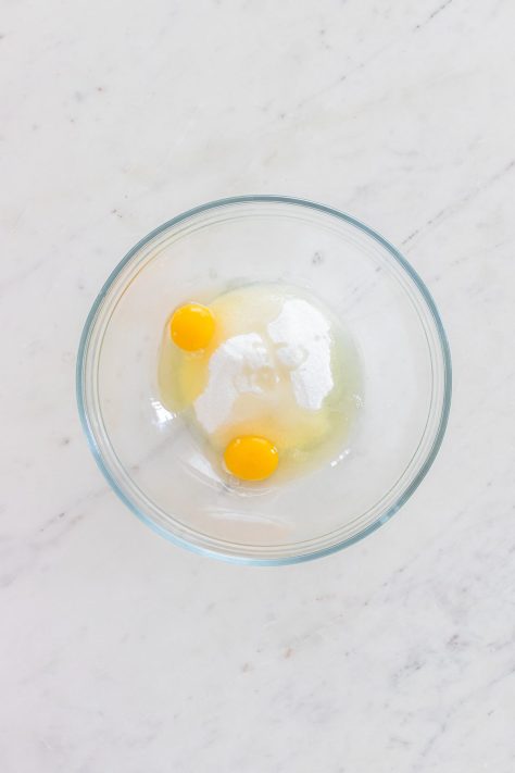 Sugar and eggs in a bowl.