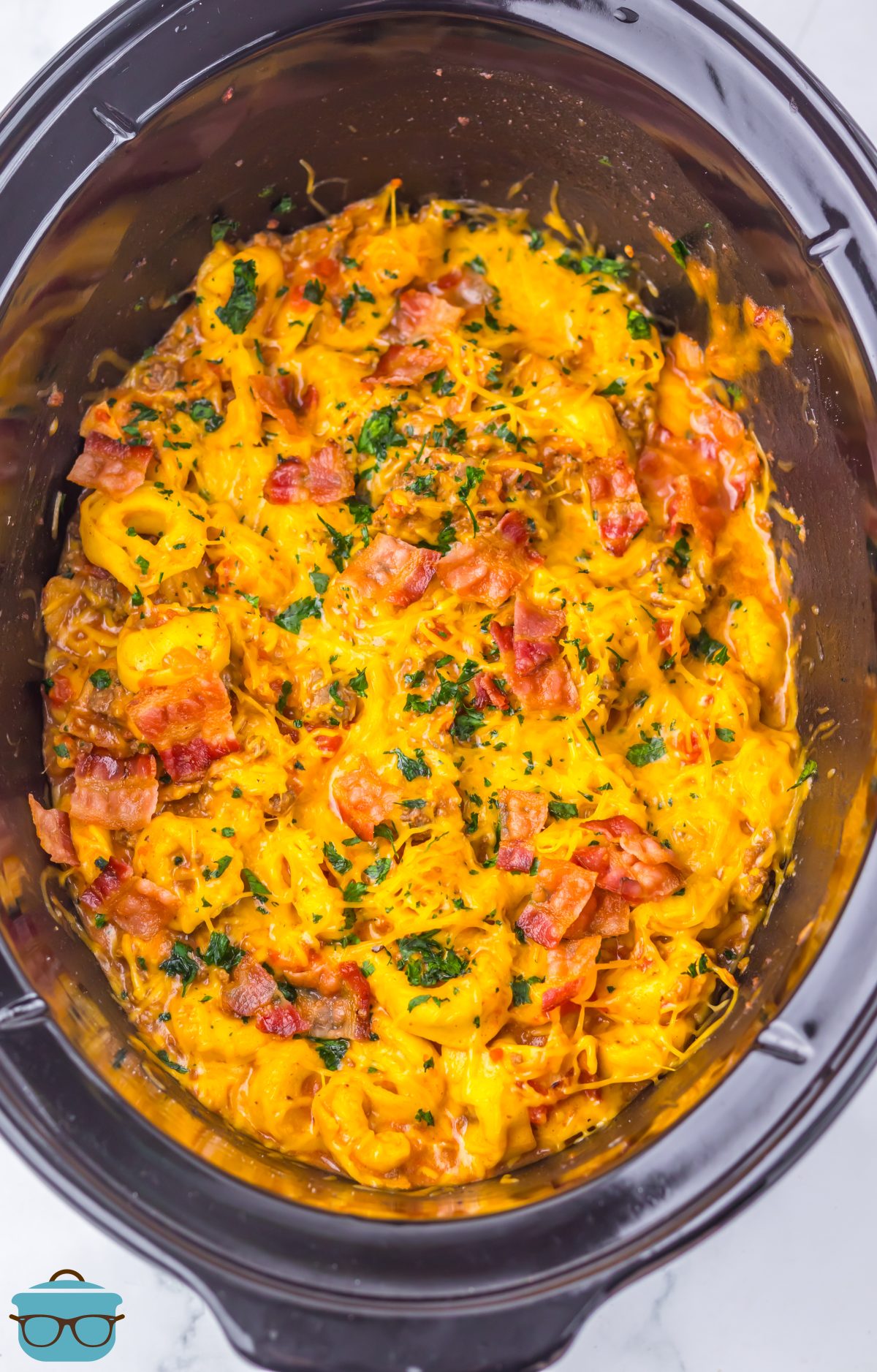Looking down on a full Slow Cooker of Cheeseburger Tortellini.