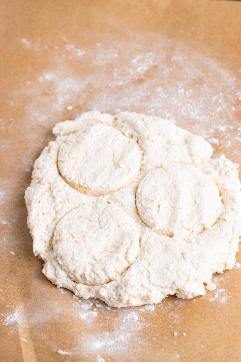 Dough being cut into biscuits.
