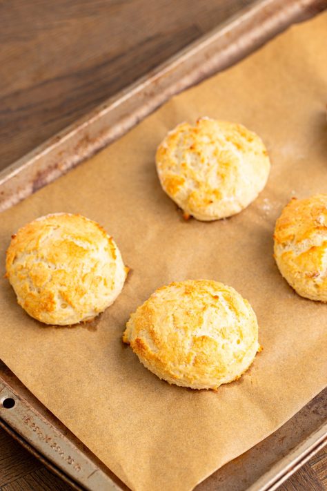 Baked biscuits on a baking sheet.