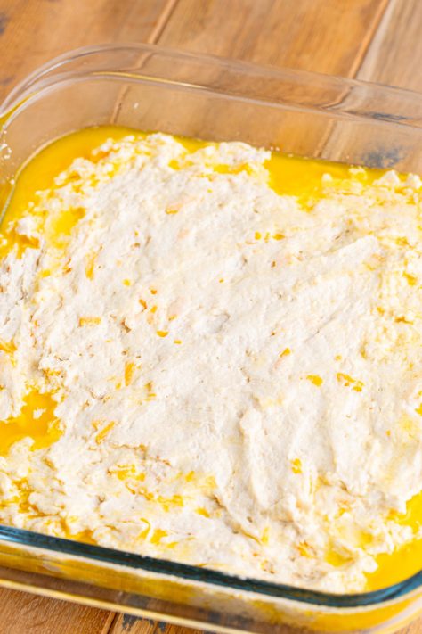 Butter and dough in a baking dish.