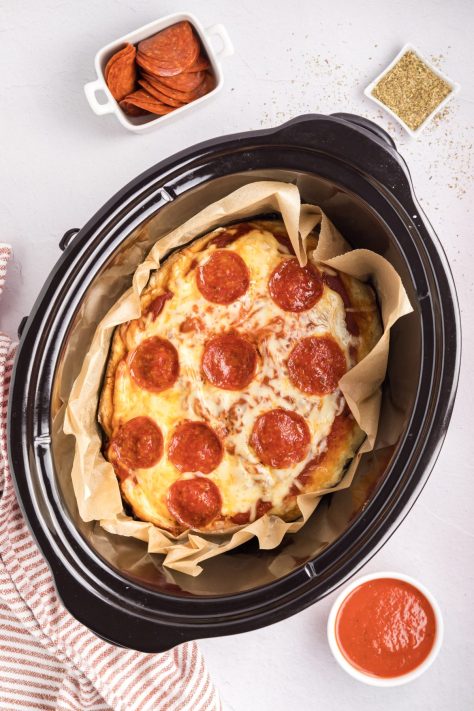A baked Deep Dish Pizza in a Slow Cooker.