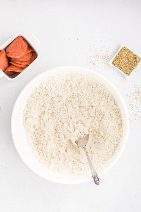 A bowl with dry ingredients for pizza dough.