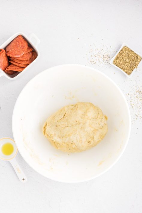 A bowl of pizza dough.