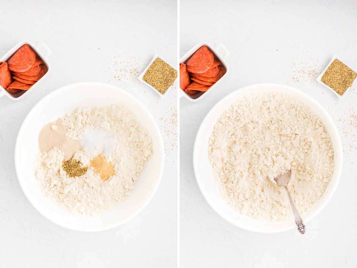 A bowl with Pillsbury Hot Roll Mix, yeast, salt, garlic powder, and oregano being mixed together.