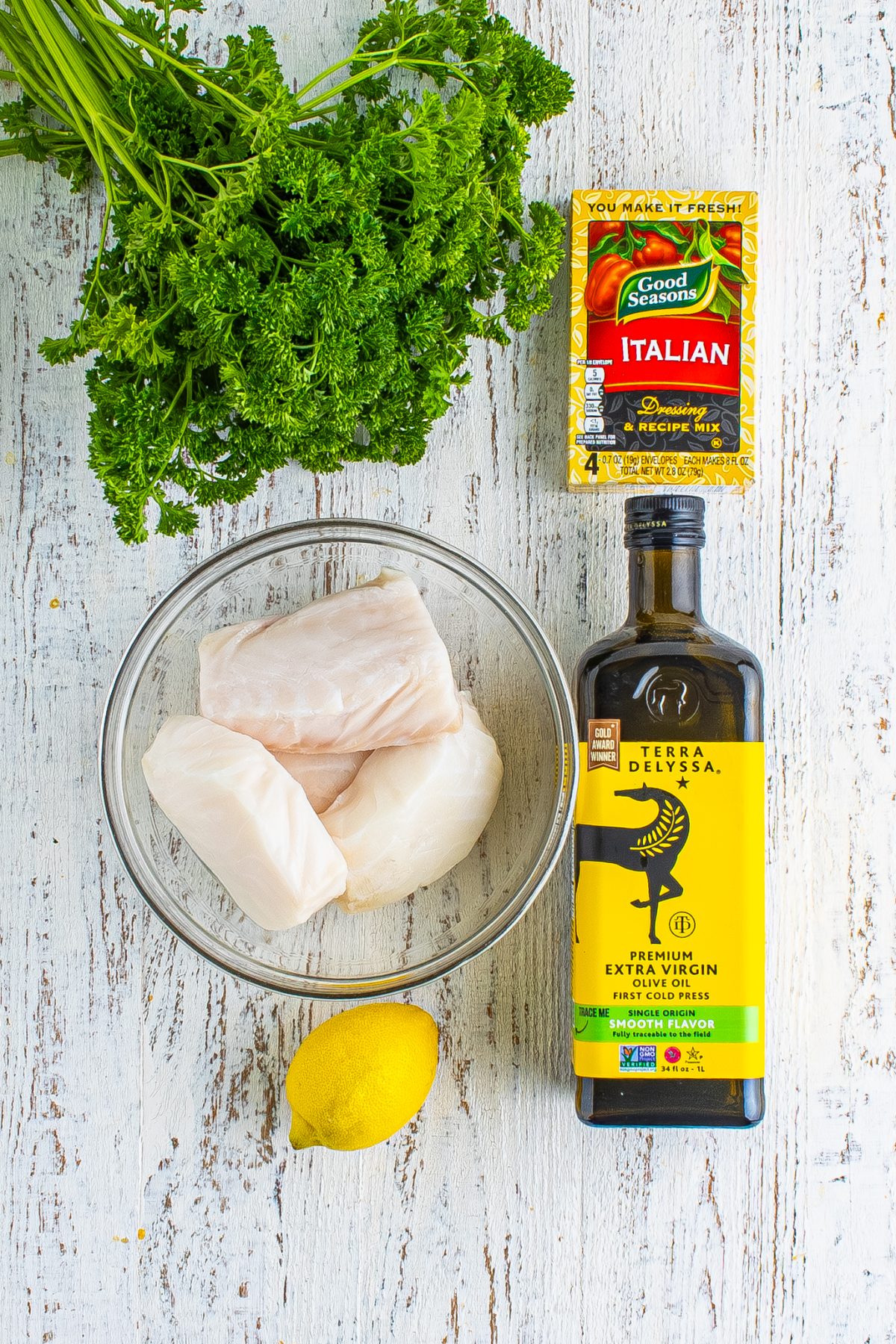 Olive oil, fresh lemon juice, zesty Italian salad dressing mix, fresh parsley, and sea bass fillets.