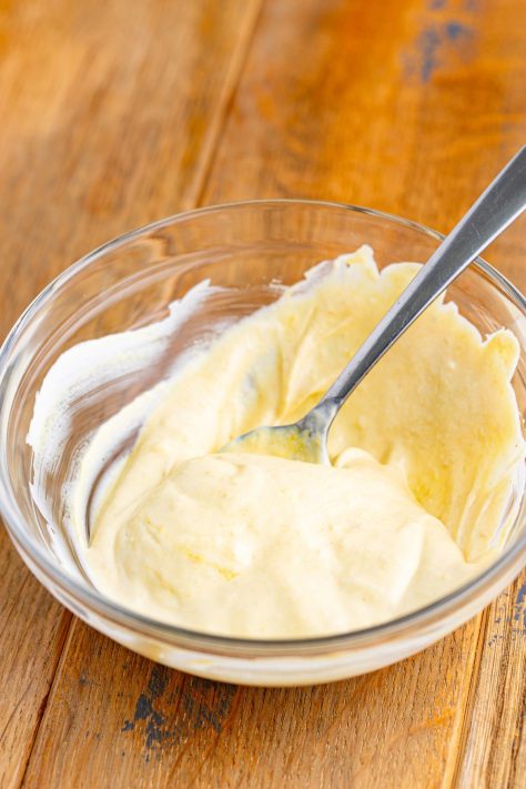Sauce being mixed in a bowl.
