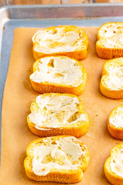 Sauce spread on pieces of Texas Toast.