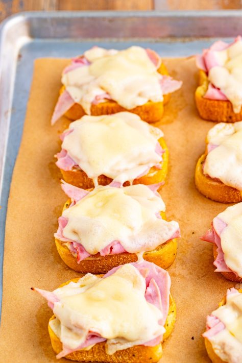 Melted cheese on ham with sauce on Texas Toast.