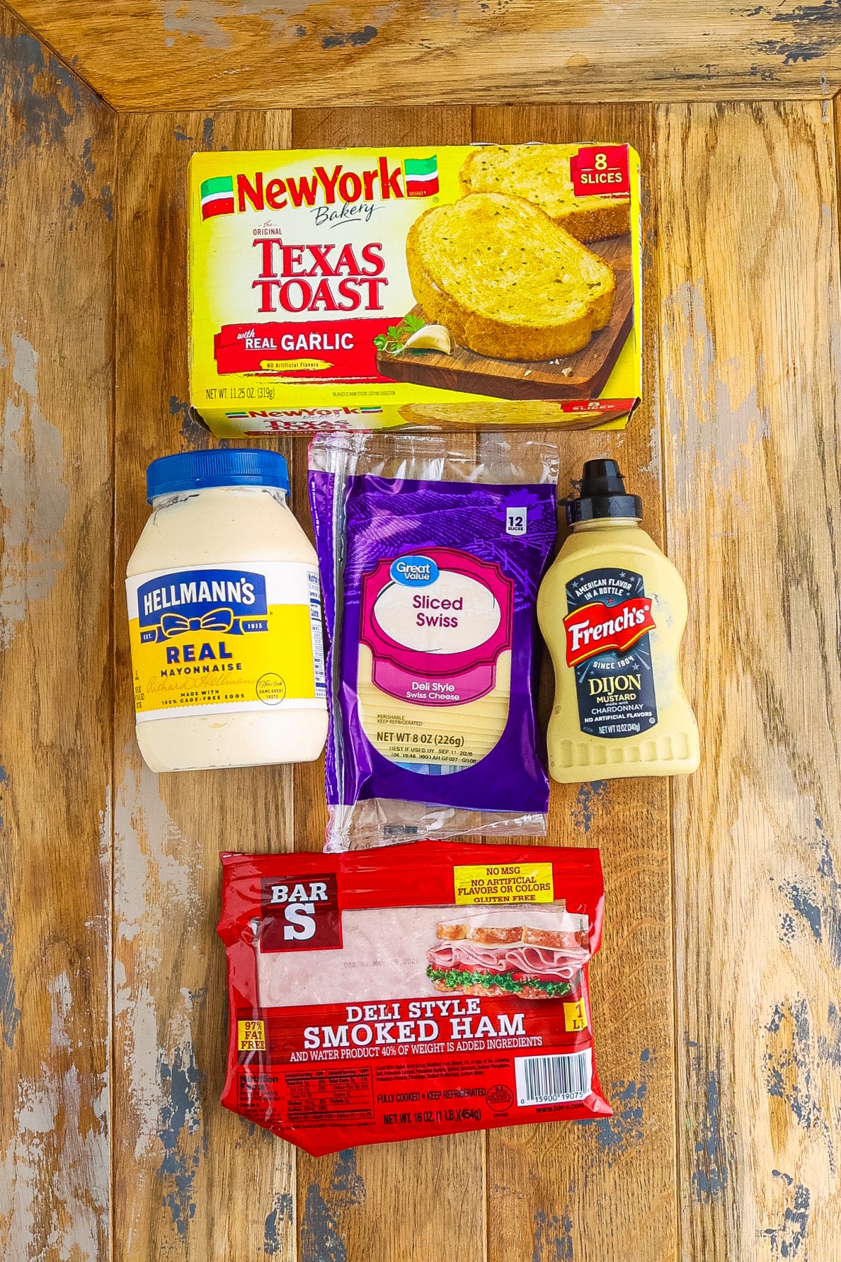 Texas toast, mayonnaise, Dijon mustard, ham, and Swiss cheese.
