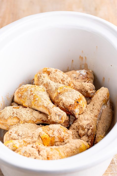Seasoned sear chicken legs in the Slow Cooker.