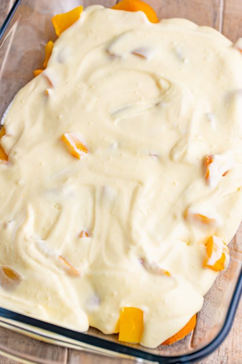 Pudding mixture over peaches and Nilla wafers.